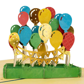 Close-up of the colorful balloons and Happy Birthday garland details in the balloon birthday pop-up card.