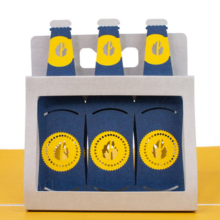 Close-up of the six-pack of beer bottles details in the beer birthday pop-up card.