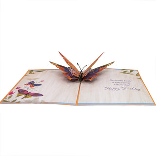 Fully open butterfly birthday pop-up card with the colorful layered butterfly and printed greeting.