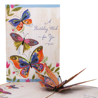Open butterfly birthday pop-up card showing the colorful layered butterfly at an angle.