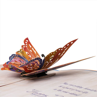 Side view showing the layered paper construction of the butterfly birthday pop-up card.