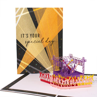 Open concert birthday pop-up card showing the concert stage with lights and a cheering crowd at an angle.