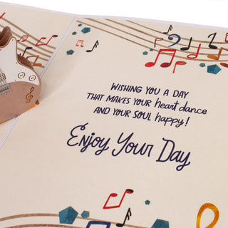 Inside message beside the electric guitar in the guitar birthday pop-up card.