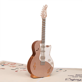 Side view showing the layered paper construction of the guitar birthday pop-up card.