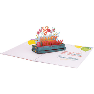Fully open happy birthday party pop-up card with the colorful Happy Birthday party decorations, balloons, and garlands and printed greeting.