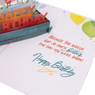 Side view showing the layered paper construction of the happy birthday party pop-up card.