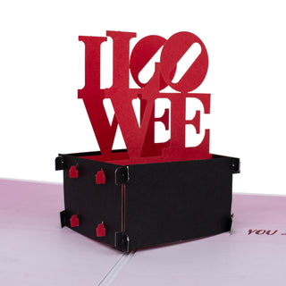 Front view of the iconic red LOVE statue inside the lOVE statue Valentine's Day pop-up card
