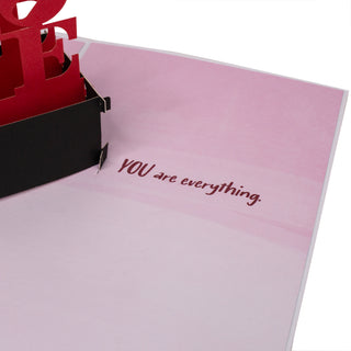 Inside message beside the iconic red LOVE statue in the LOVE statue Valentine's Day pop-up card