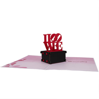 Side view showing the layered paper construction of the lOVE statue Valentine's Day pop-up card